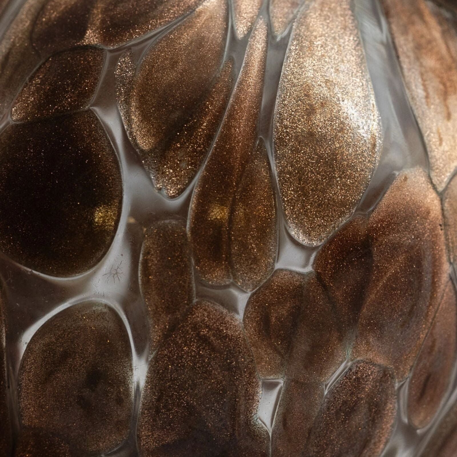 Close-up of a textured surface with brown and gold patterns