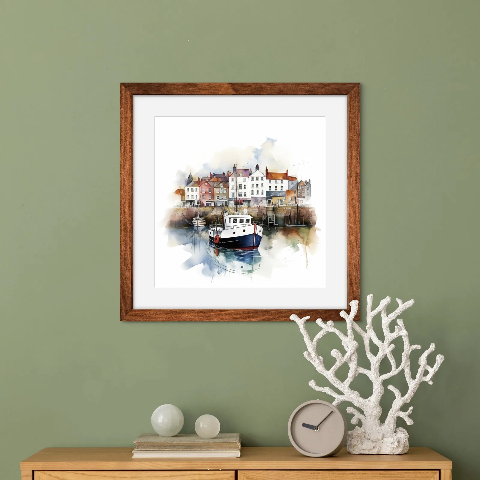 Watercolour artwork of a coastal village with cottages and boats in a harbour.