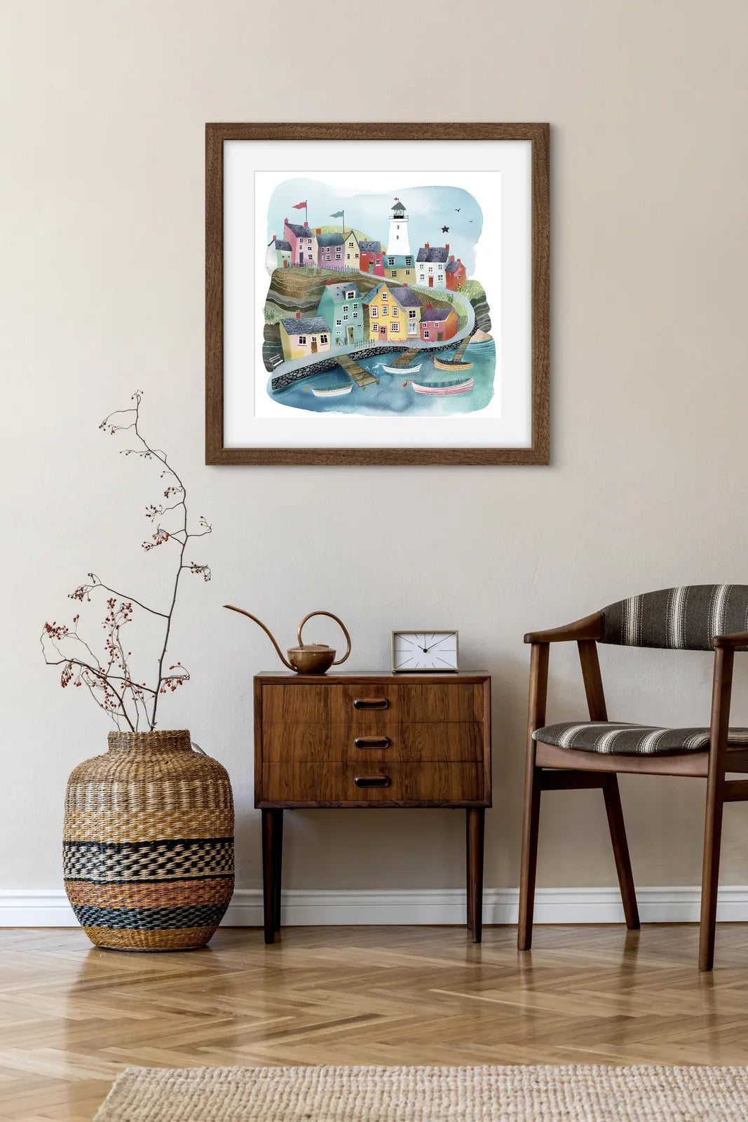 Colourful coastal village art print with lighthouse and boats.