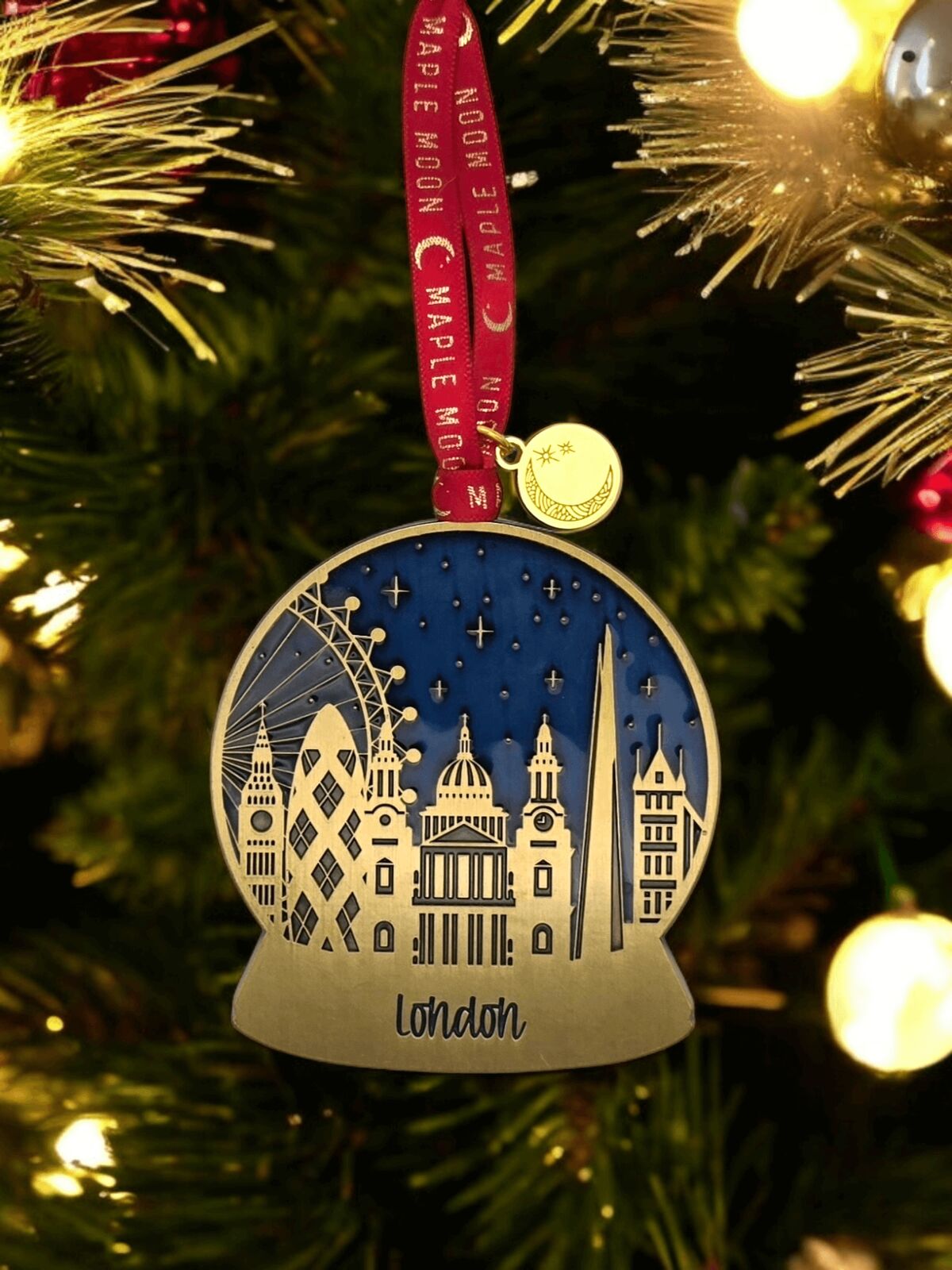 Christmas globe ornament with London skyline design on a tree