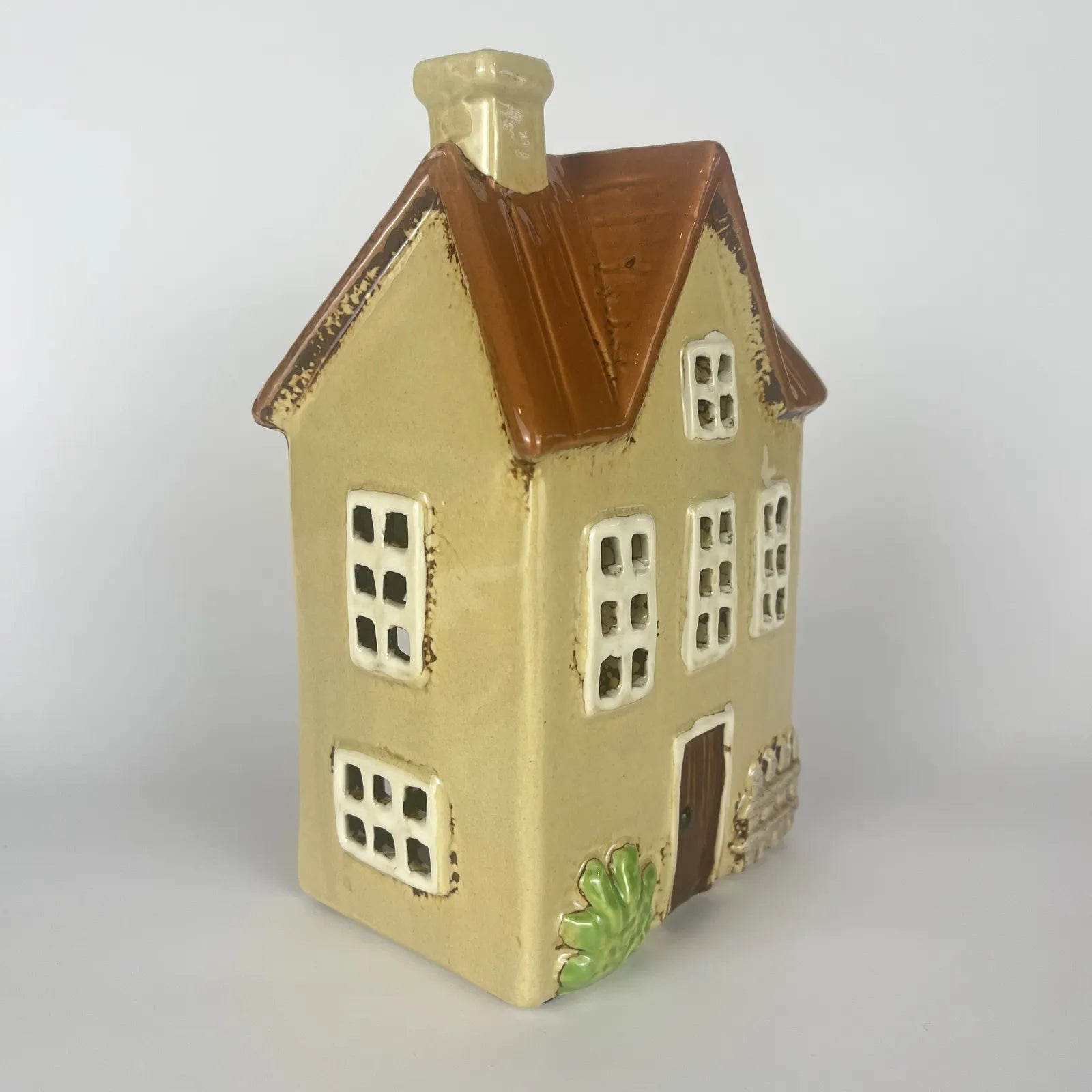 Yellow Ceramic Tealight House with Brown Roof and Green Foliage