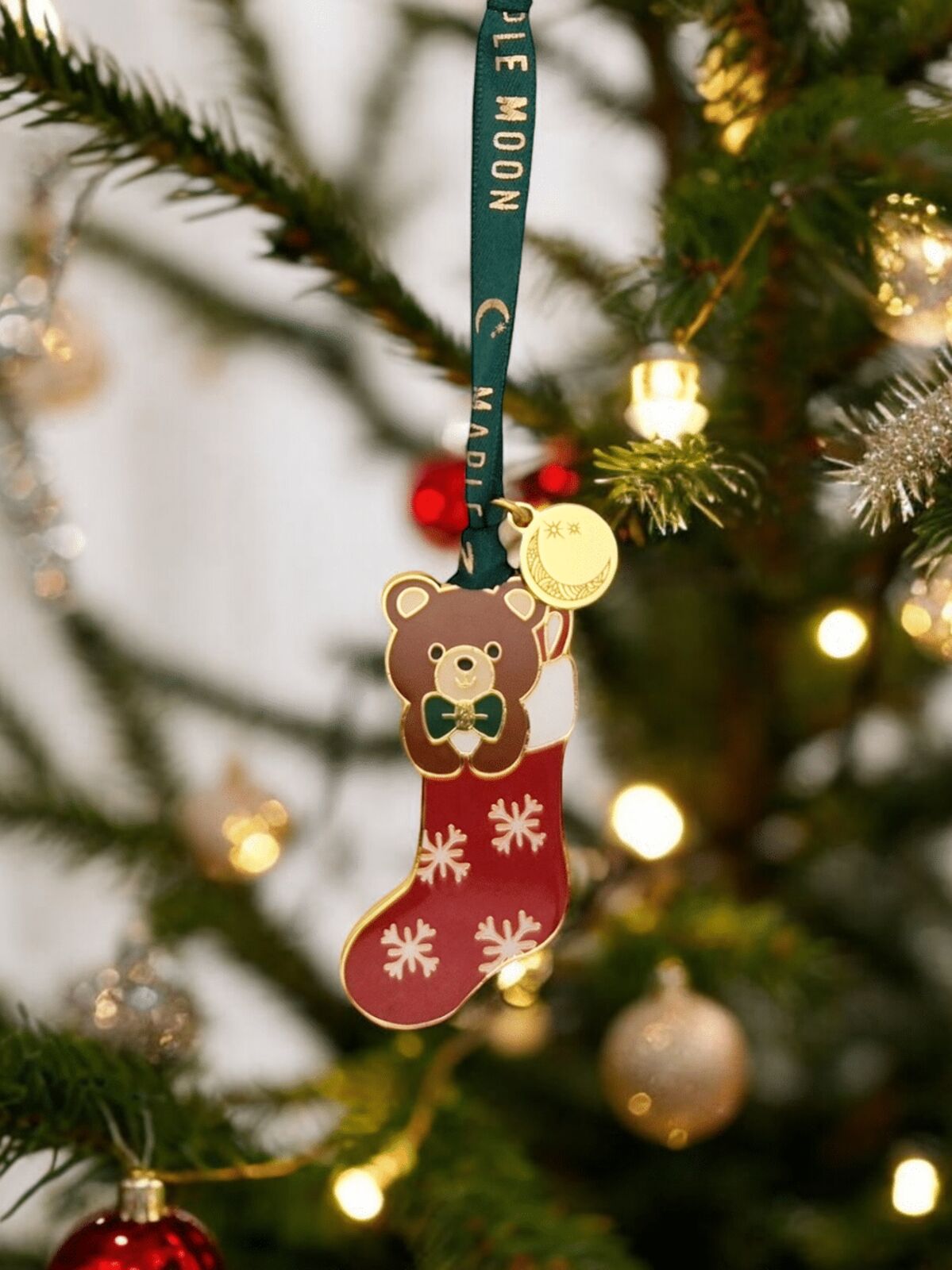Christmas ornament with a bear design on a tree