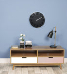 Striking Black Wall Clock In Polished Steel