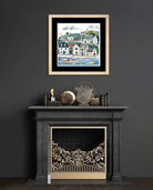 Art print of a coastal village with cottages and boats in a harbour, in earthy and blue tones.