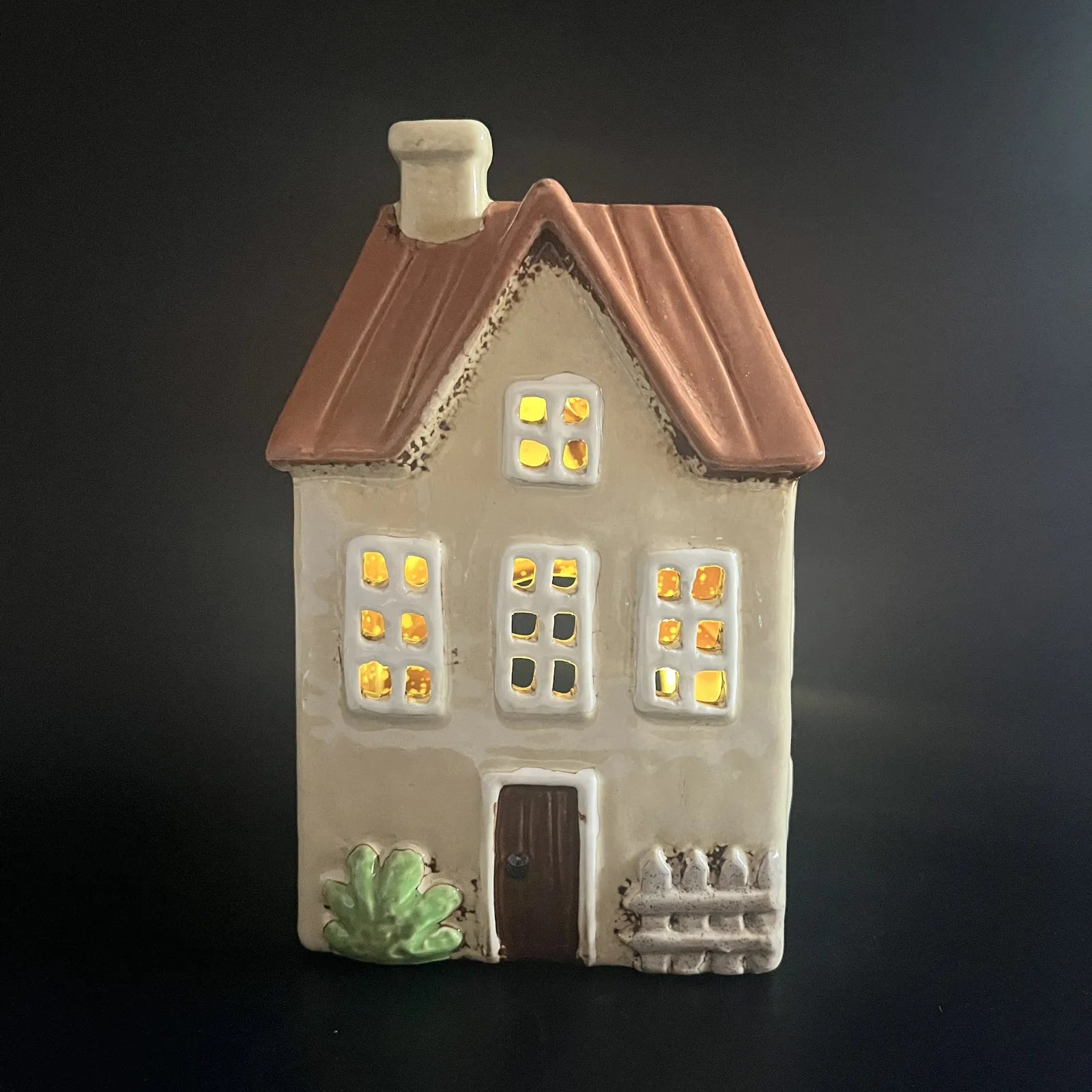 Yellow Ceramic Tealight House with Brown Roof and Green Foliage