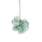 A light green glass grape cluster hanging ornament suspended from a natural jute string against a solid white background.