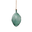 A translucent green glass ornament shaped like a teardrop or leaf, hanging from a natural jute twine string against a solid white background.